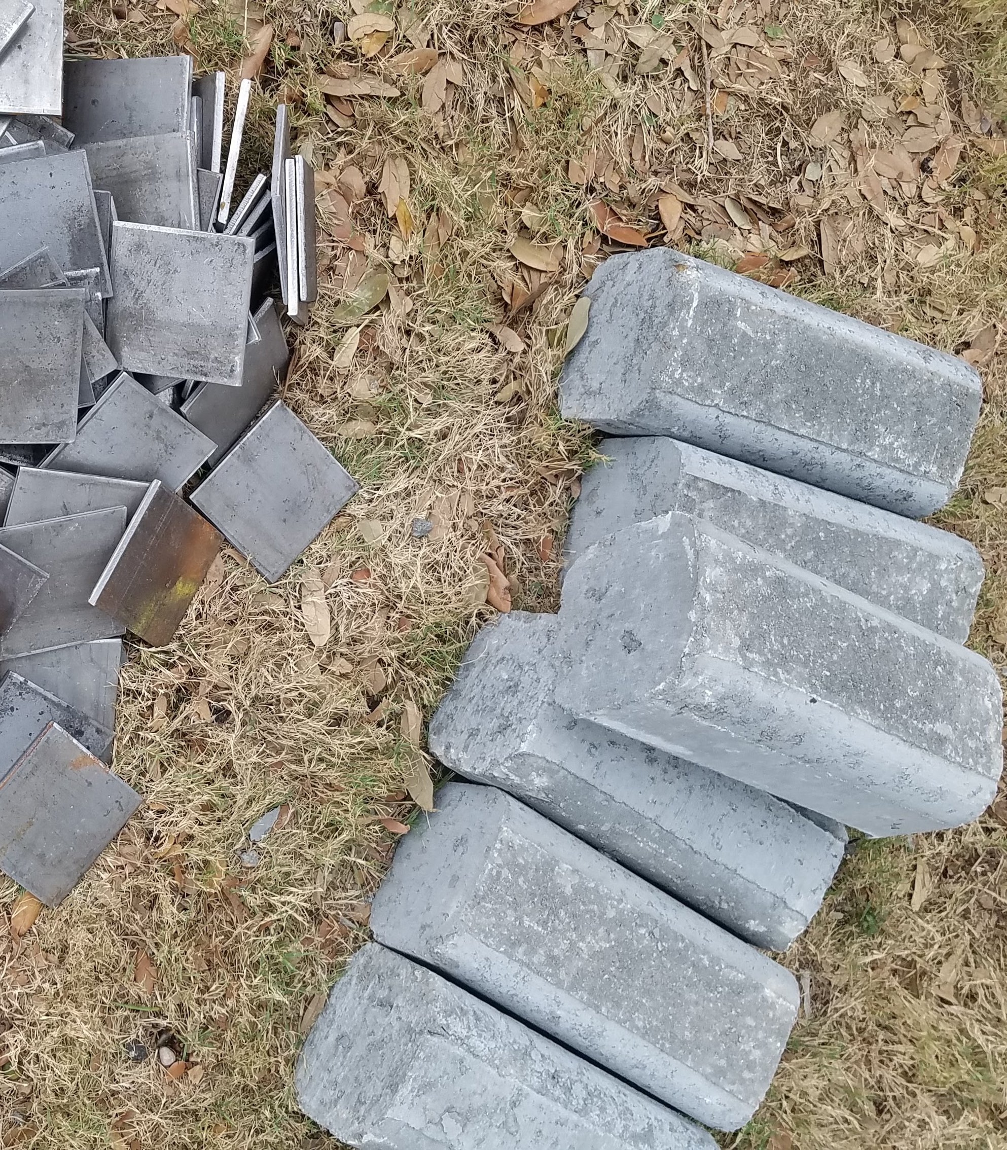 Steel shims and concrete piers used in foundation repair